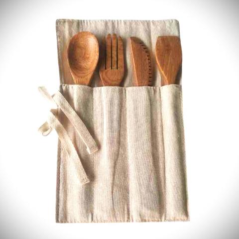 Cutlery holder and wooden cutlery. Image