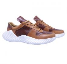 Fashionable sneakers in brown leather Image