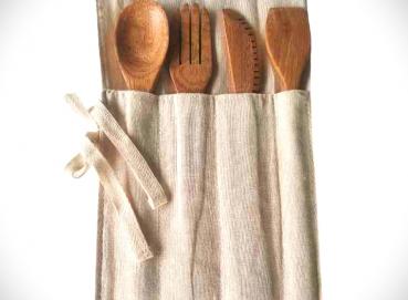 Cutlery holder and wooden cutlery. Image