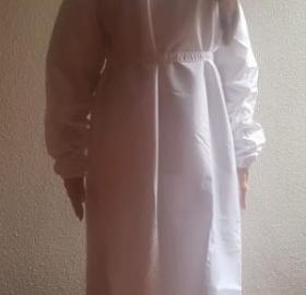 Protective gown with textile tie