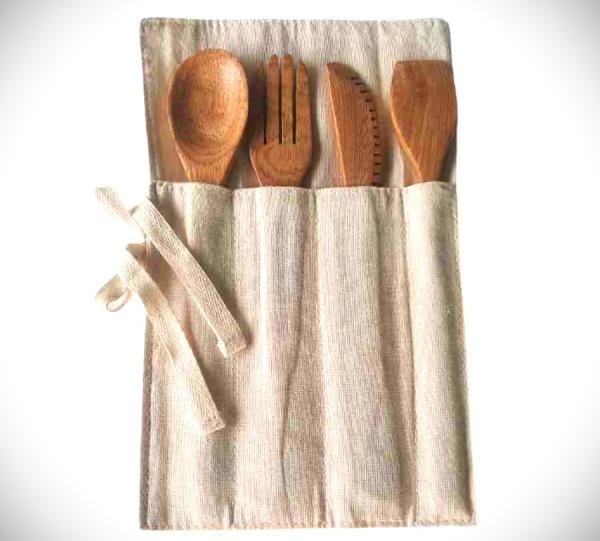Cutlery holder and wooden cutlery. Image